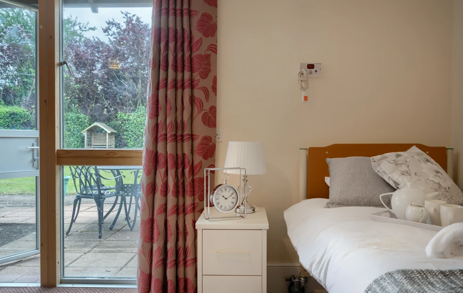 Bedroom with view of the garden at Abbeyfield House, New Malden