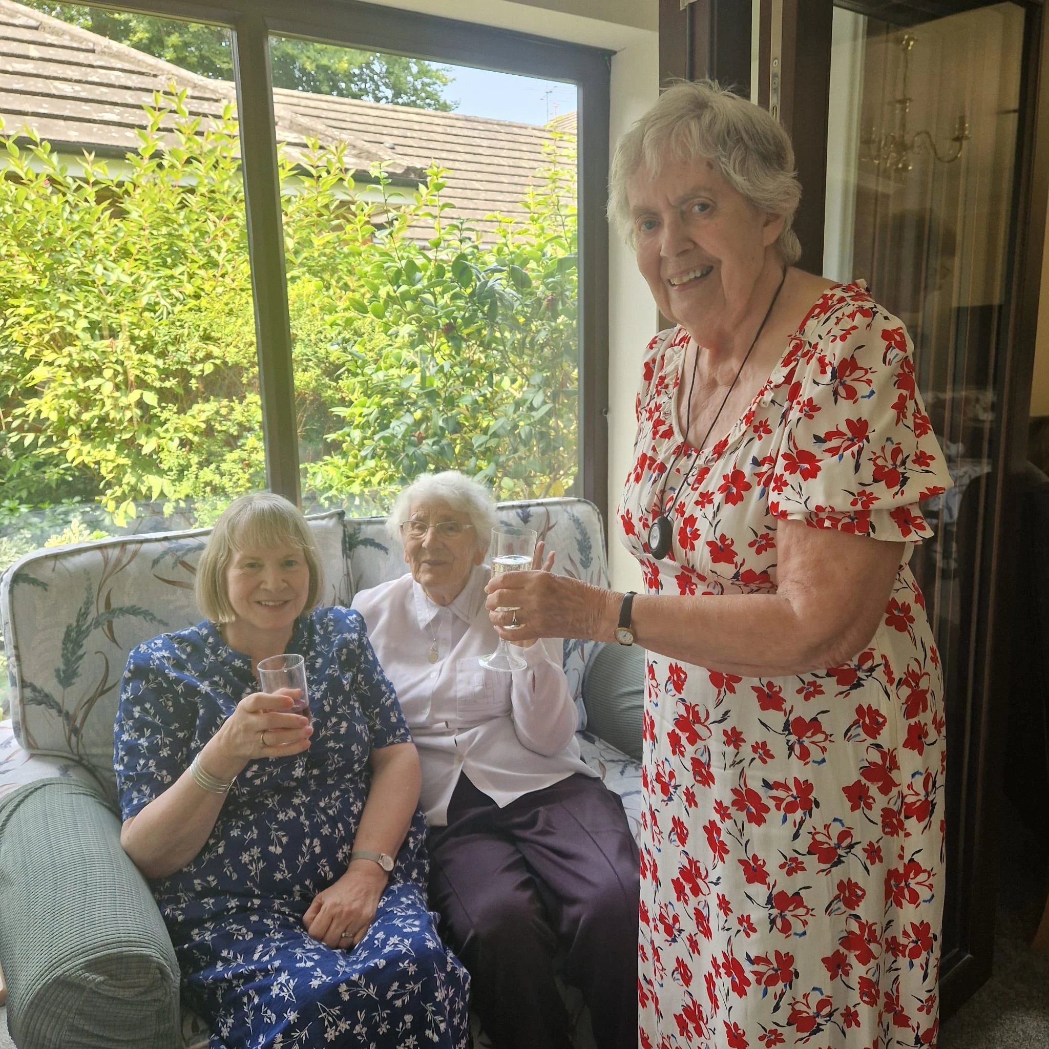 three woman making a toast