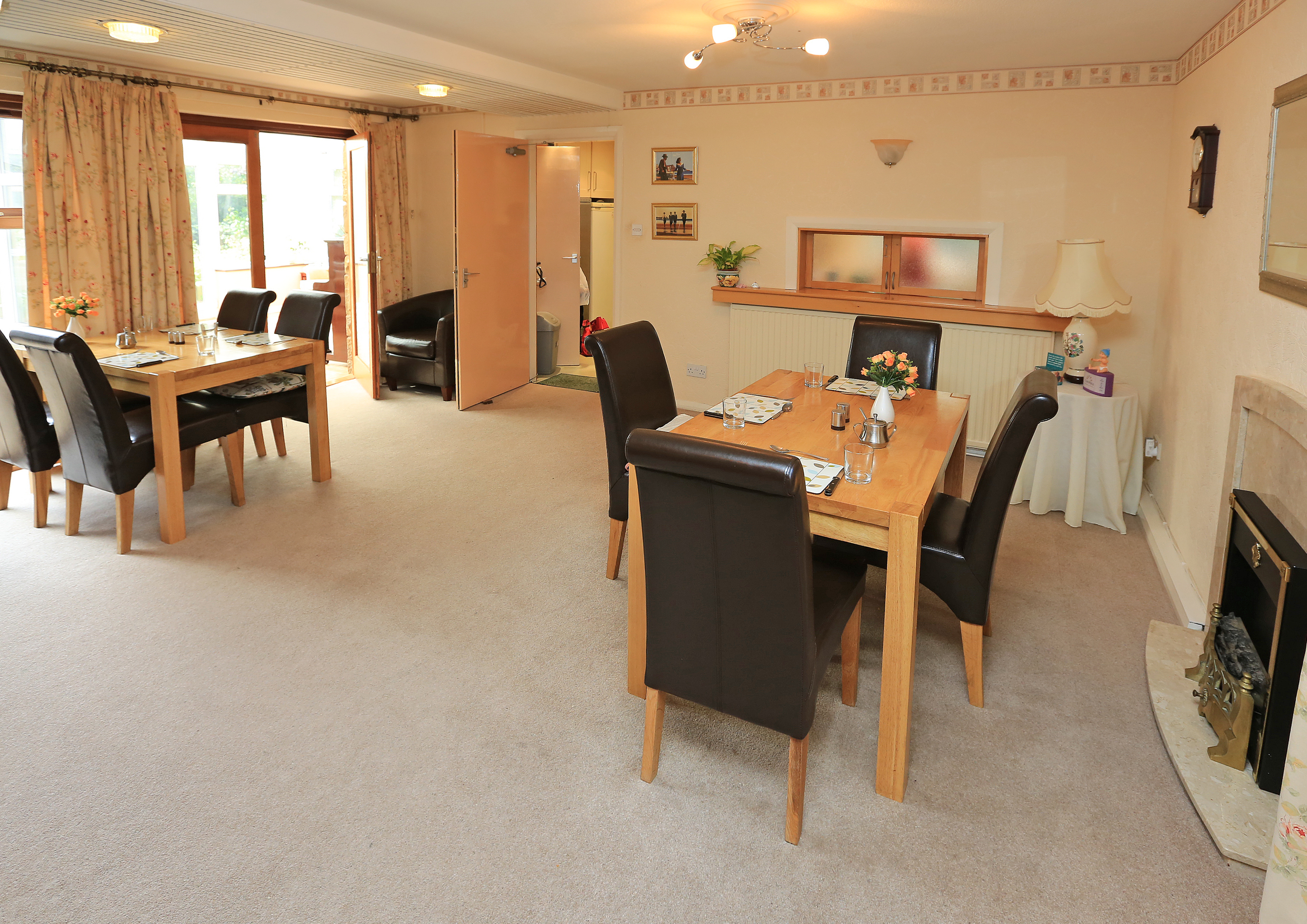 The house dining area with two large tables set for dinner