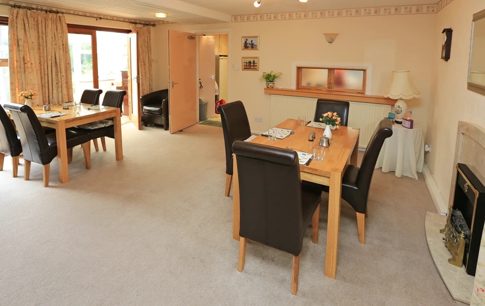 The house dining area with two large tables set for dinner