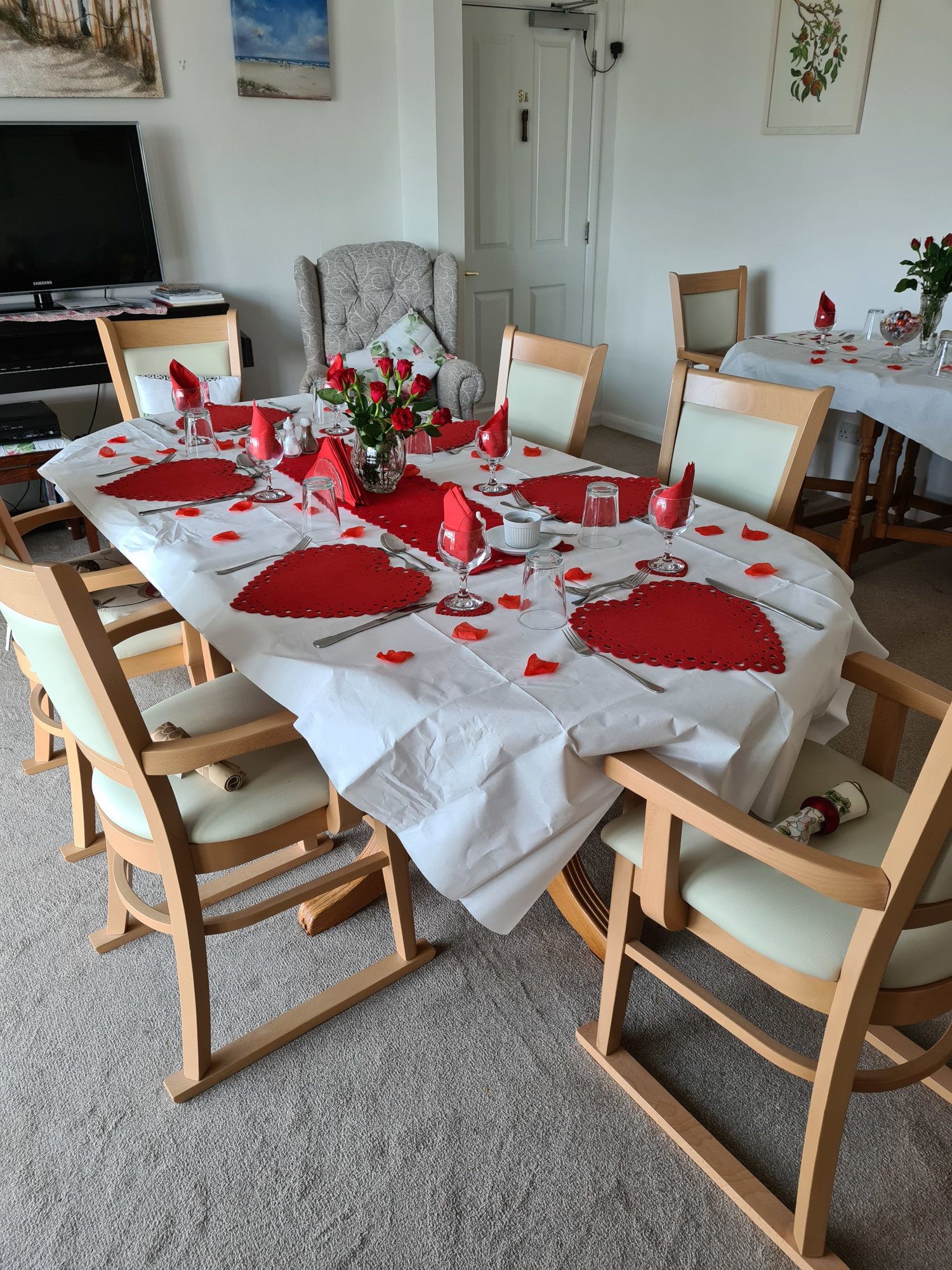 Dining room set for Valentines Day at Abbeyfield Scott House, Mawnan Smith TR11 5ER