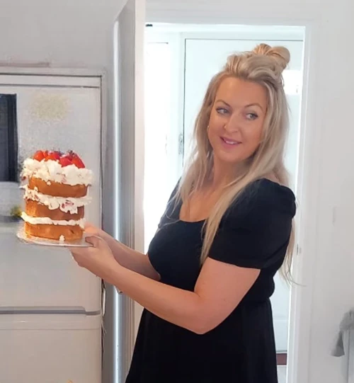 A woman with a cake 