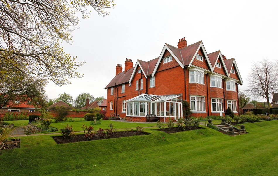 Large Red Bricked House With A Conservatory And Large Garden