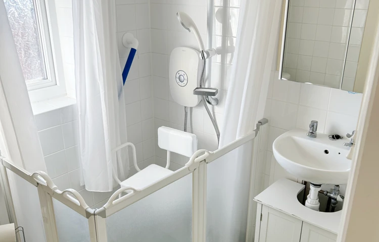 Accessible Shower Room At Abbeyfield West Wight With Grab Bars And Shower Seat