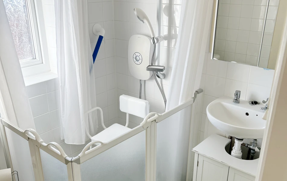 Accessible Shower Room At Abbeyfield West Wight With Grab Bars And Shower Seat