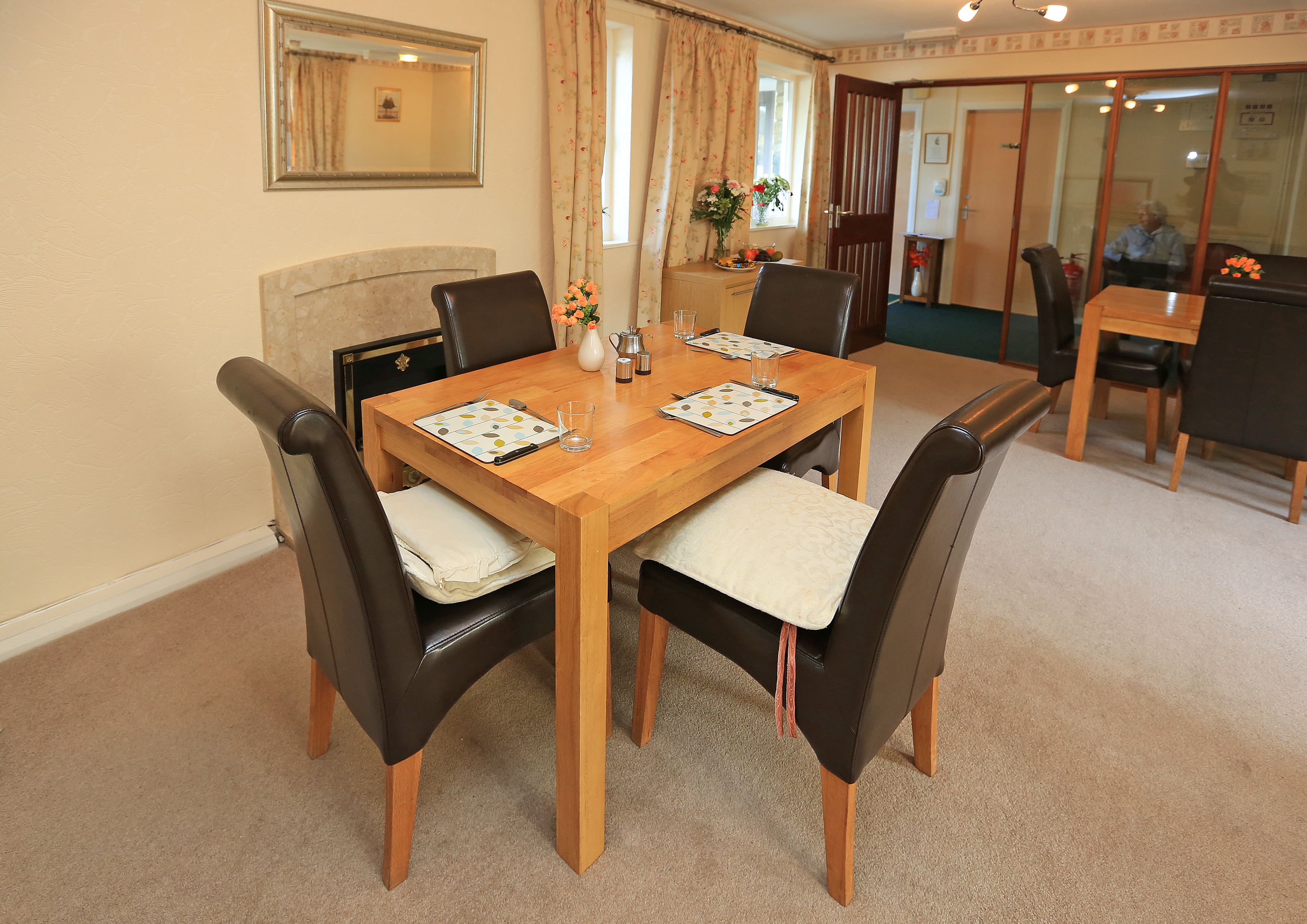 A modern dining table with leather chairs
