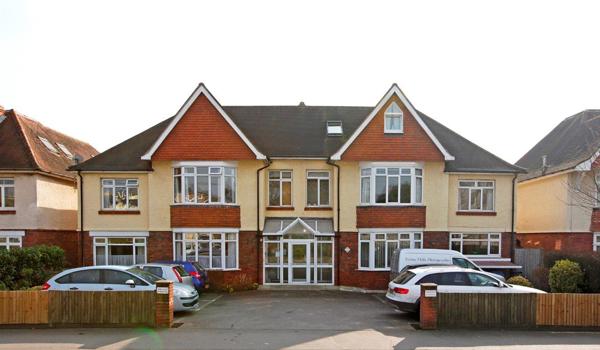 Front exterior of Oakshade with car park at the front