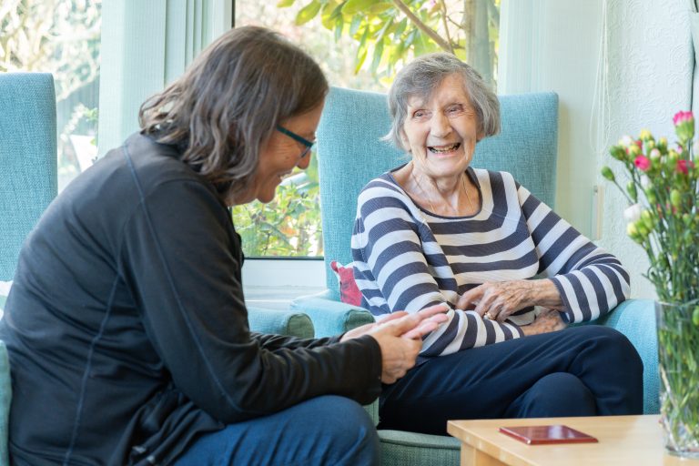 Staff Member And Resident Enjoying Time Together on Roundhay, GU1 2JH