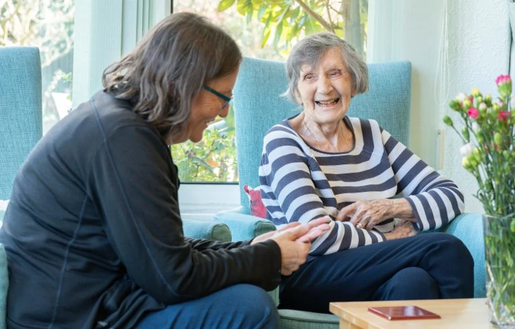 Staff Member And Resident Enjoying Time Together on Roundhay, GU1 2JH