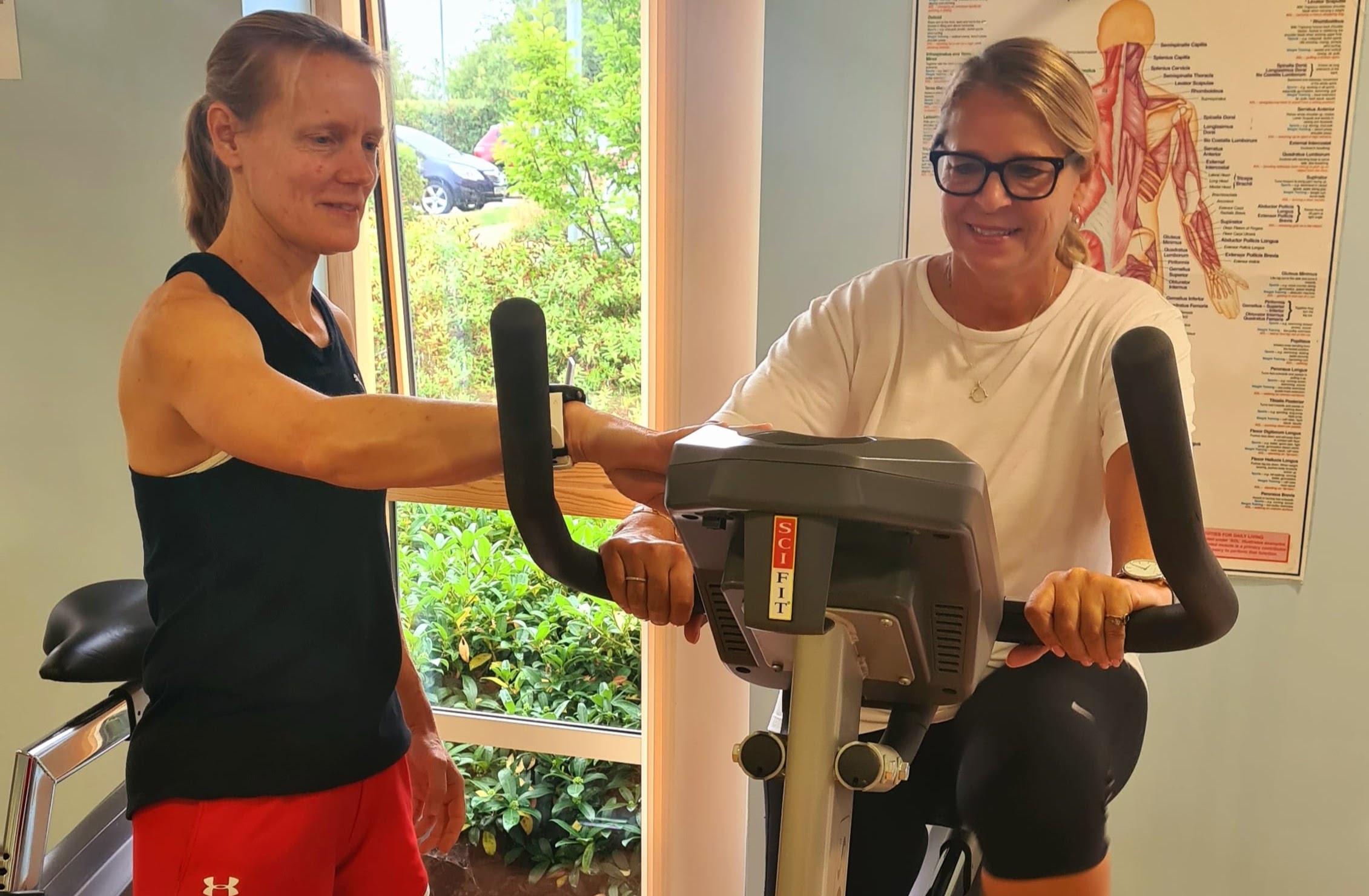 Two women keep fit in the gym at Girton Green