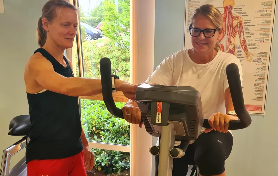 Two women keep fit in the gym at Girton Green