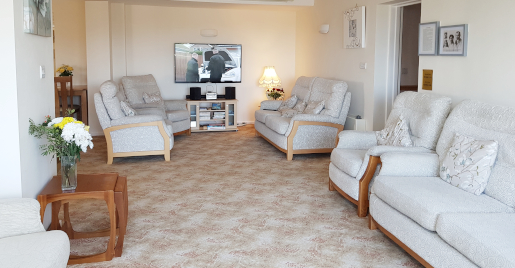 Lounge area with tv and chairs