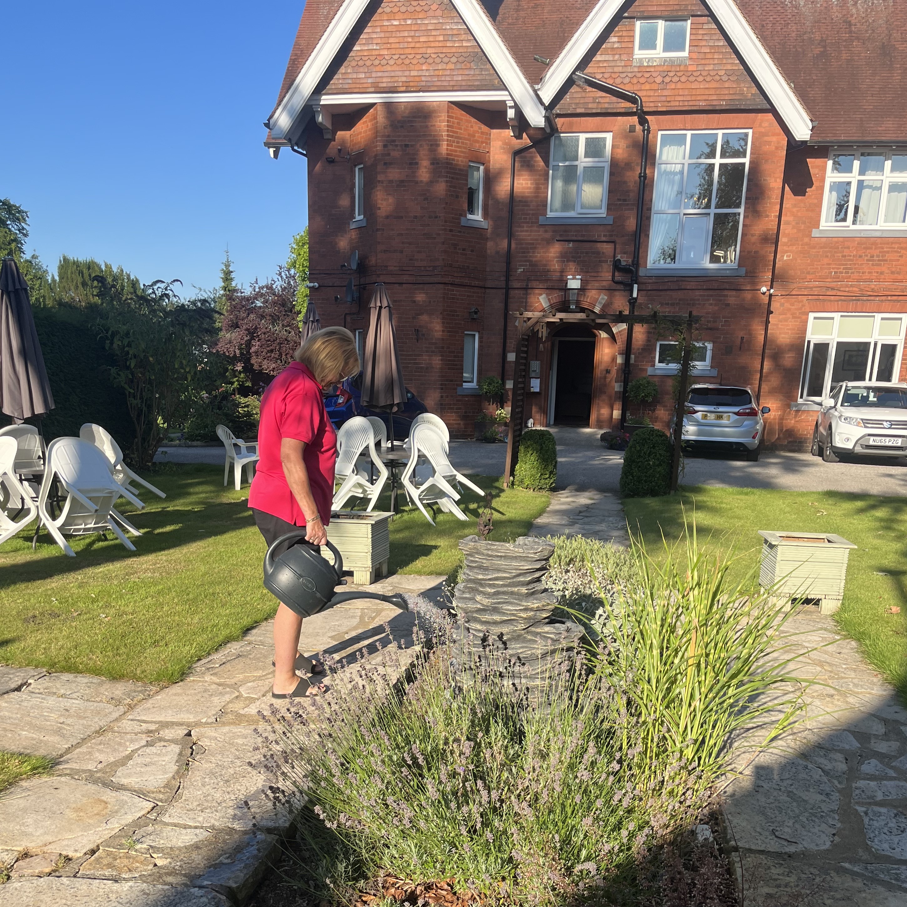 Watering the flowers at Sir Charles Starmer House, Darlington DL3 8PD