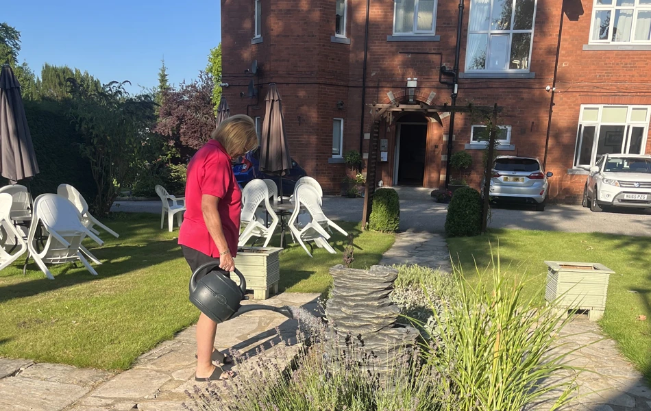 Watering the flowers at Sir Charles Starmer House, Darlington DL3 8PD