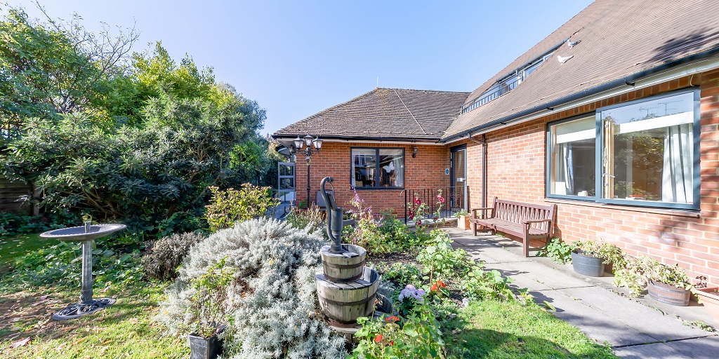 Winton House garden with bird bath and water feature