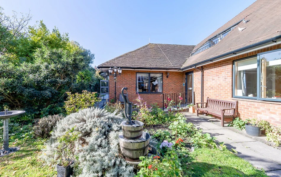 Winton House garden with bird bath and water feature