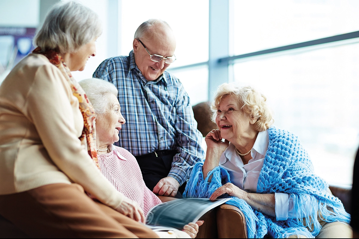 Group Of Older People Sitting Together Catching Up