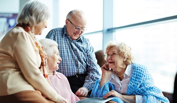 Group Of Older People Sitting Together Catching Up