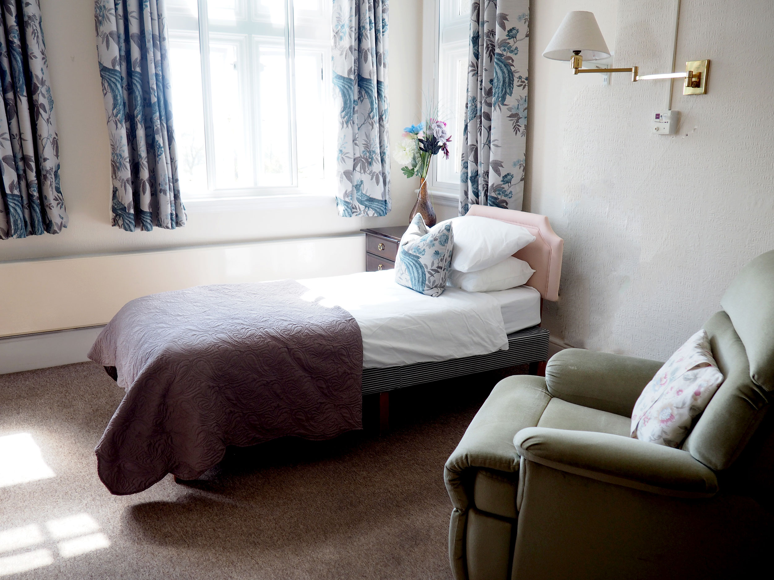 Single bed and chair at Hill House