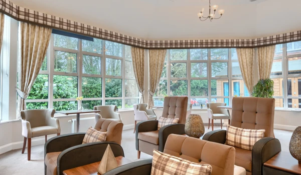 Residents cinema lounge at Westall House with lots of seating and modern windows.