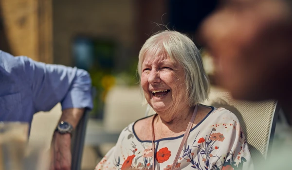 Older Woman Smiling In The Sunshine