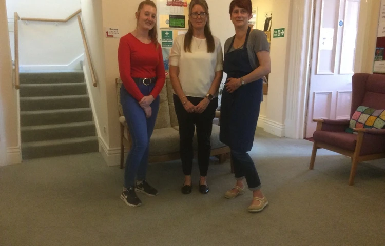 Staff stand together in the entrance