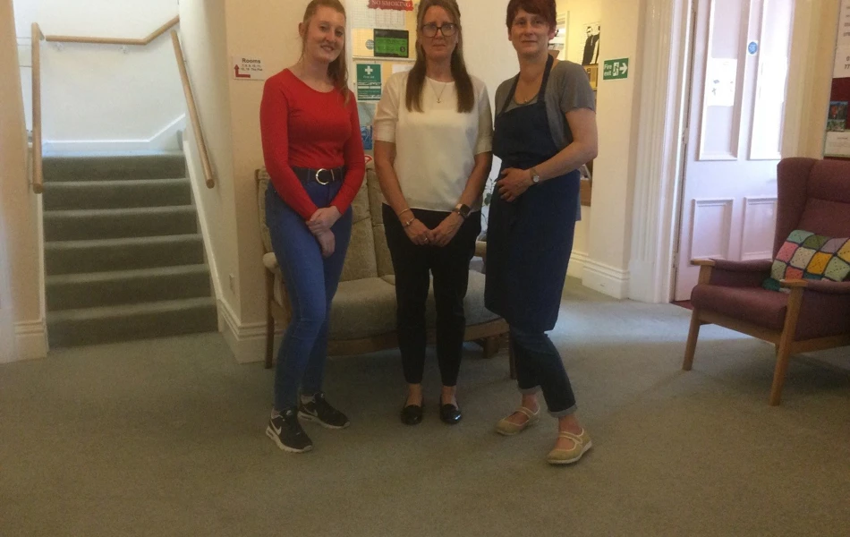 Staff stand together in the entrance