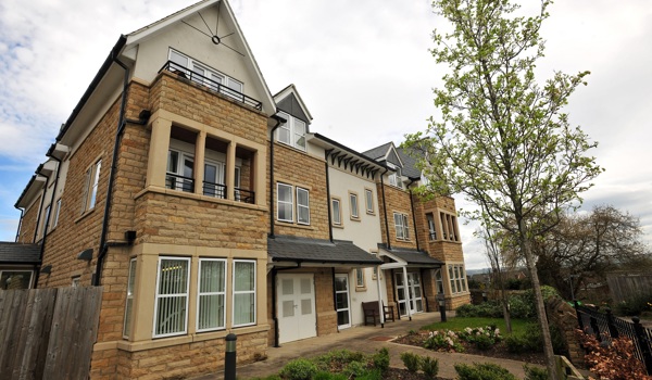 Abbeyfield The Beeches is modern stone house with balconies