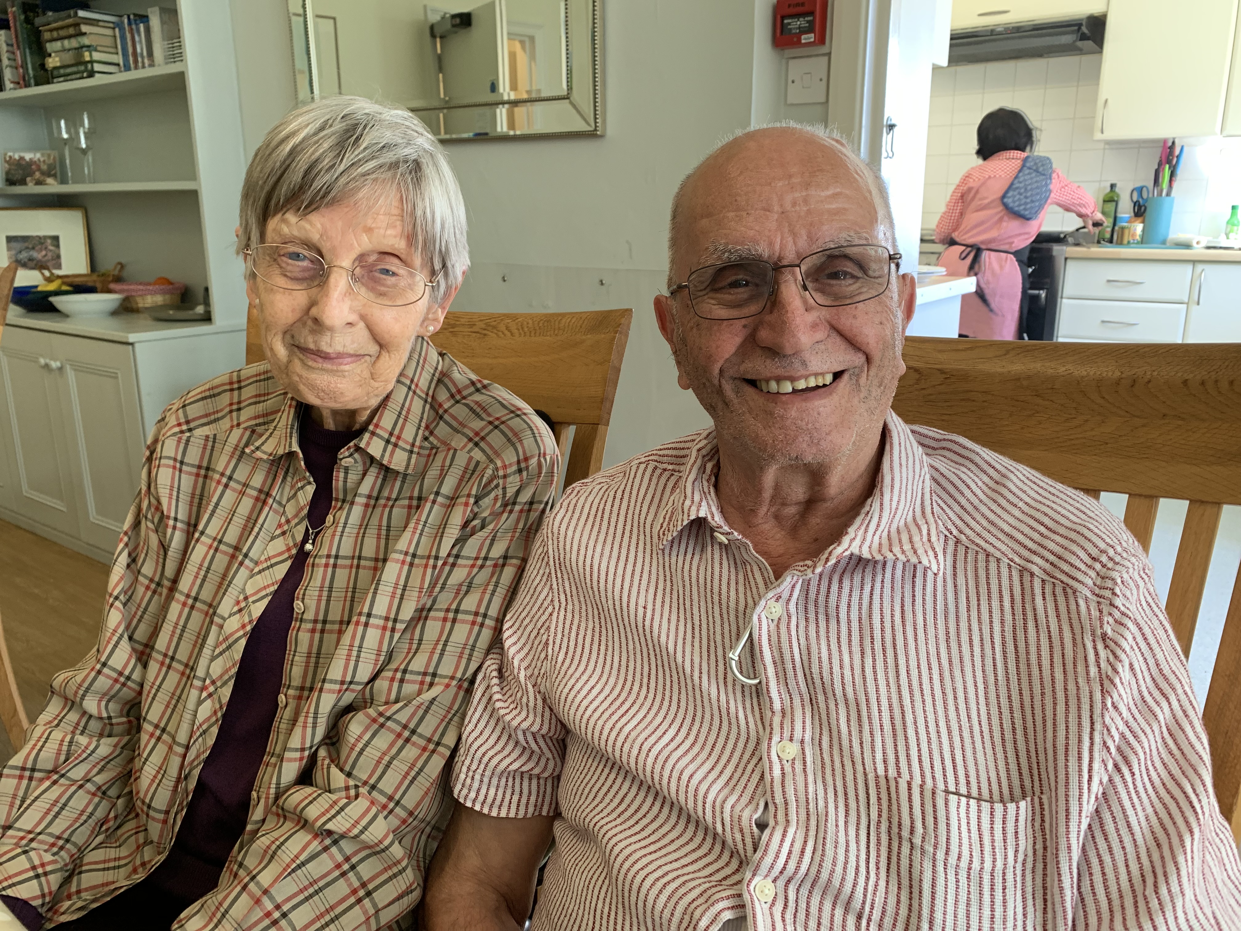 Two residents sitting happily together