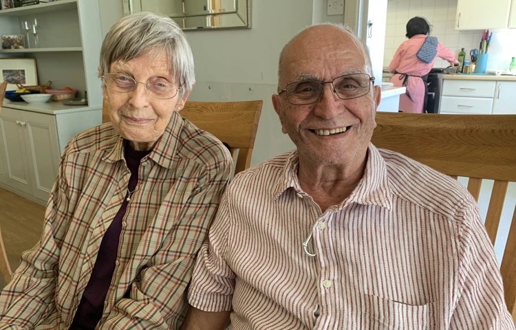 Two residents sitting happily together