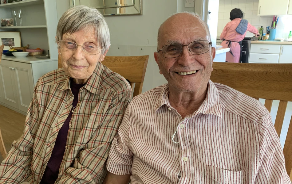 Two residents sitting happily together