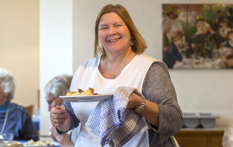 Serving hot food at Abbeyfield House, Bristol BS9 3AU