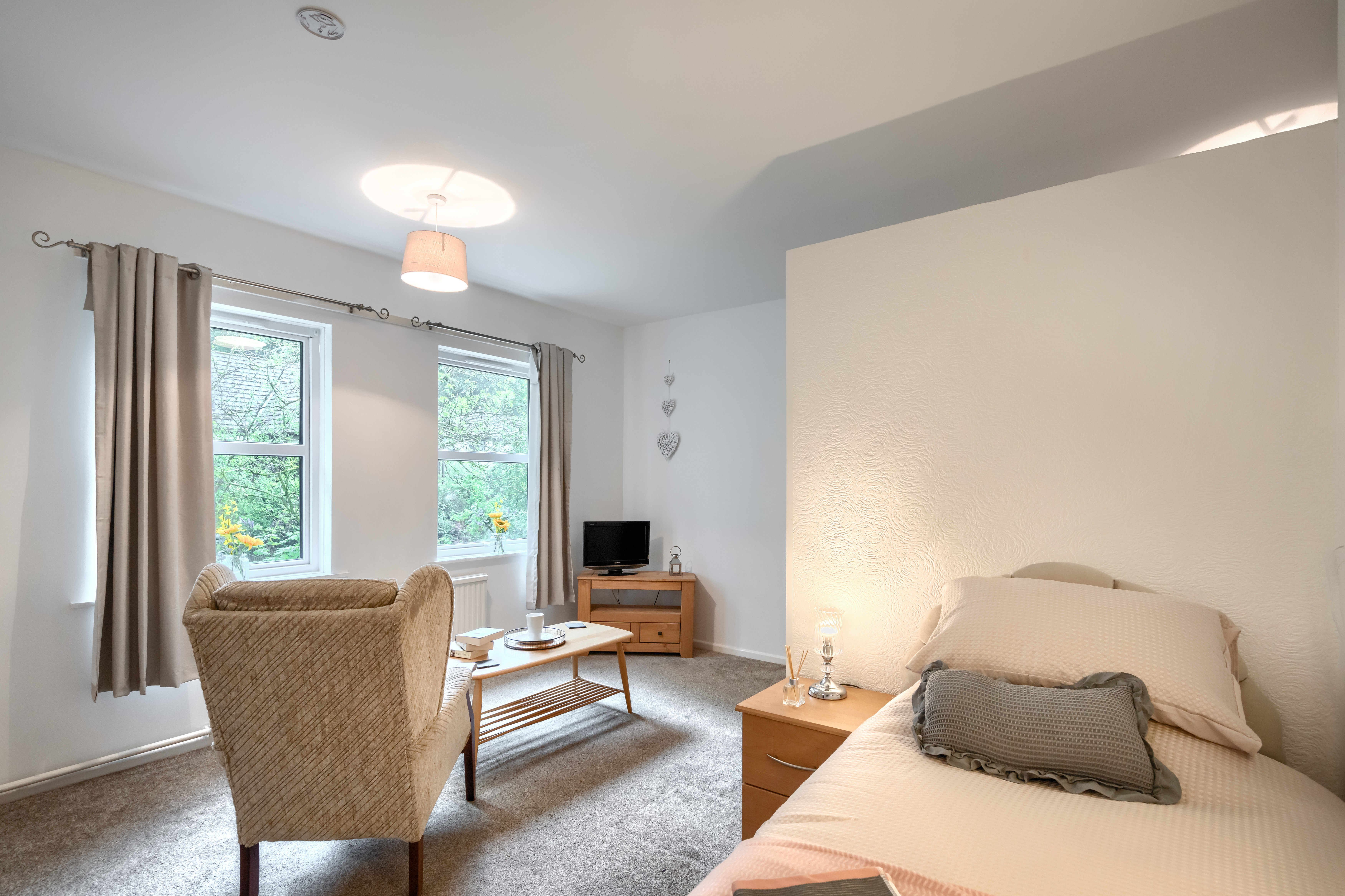 bedroom-and-lounge-area-at Abbeyfield House, Cockermouth CA13 9RH (1)