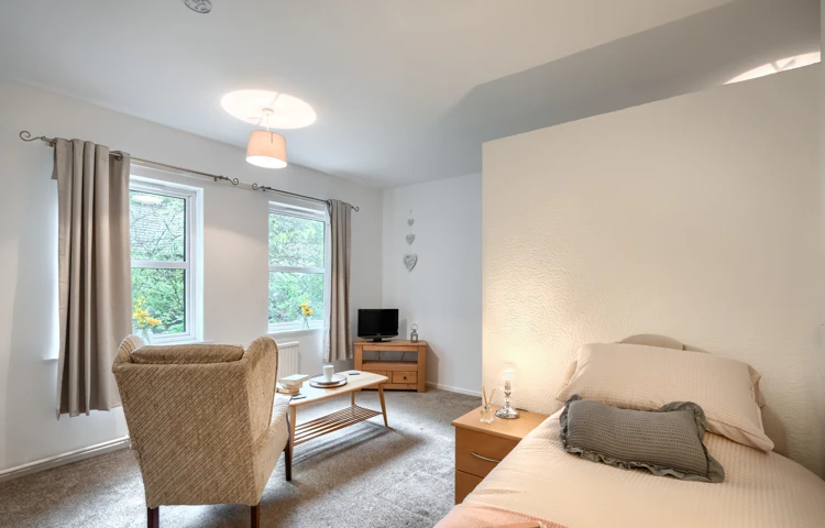 bedroom-and-lounge-area-at Abbeyfield House, Cockermouth CA13 9RH (1)