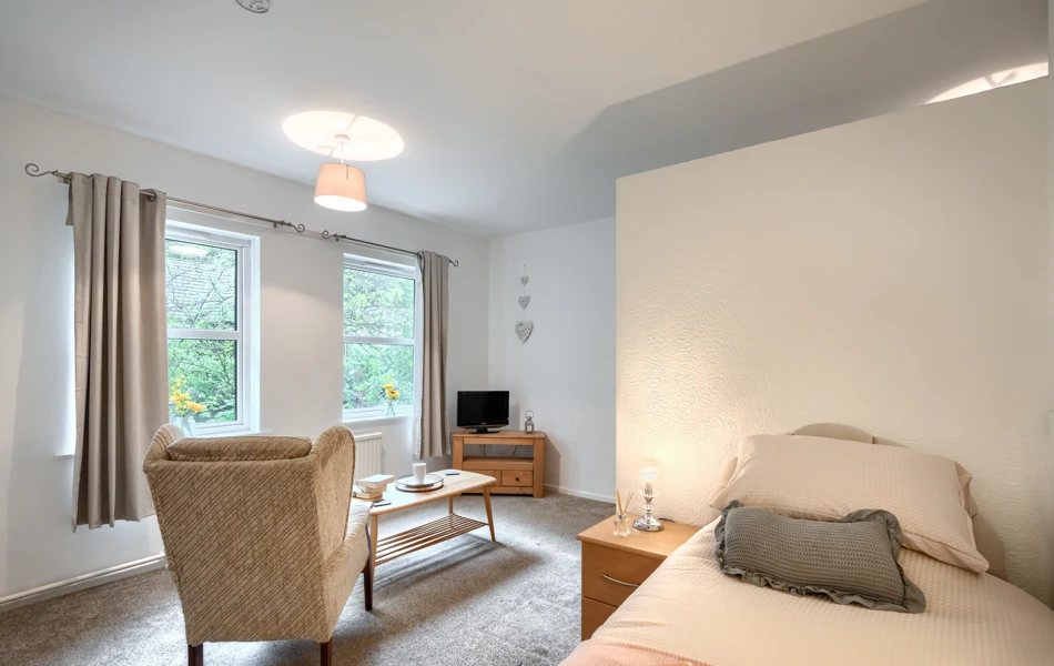 bedroom-and-lounge-area-at Abbeyfield House, Cockermouth CA13 9RH (1)