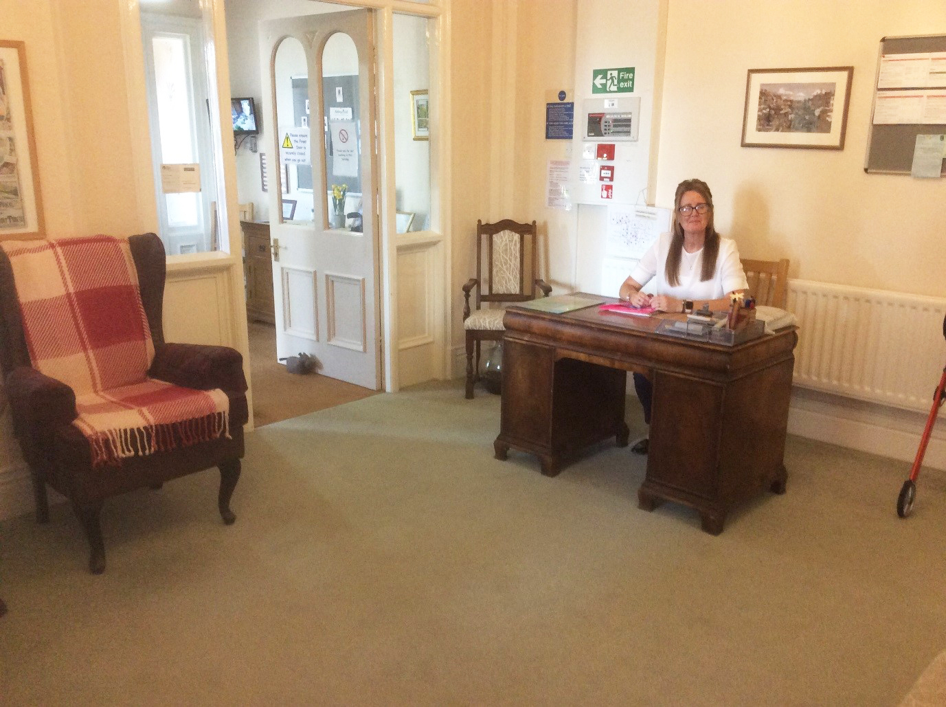 Reception area with a member of staff at a desk