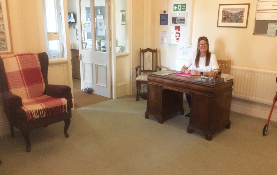 Reception area with a member of staff at a desk