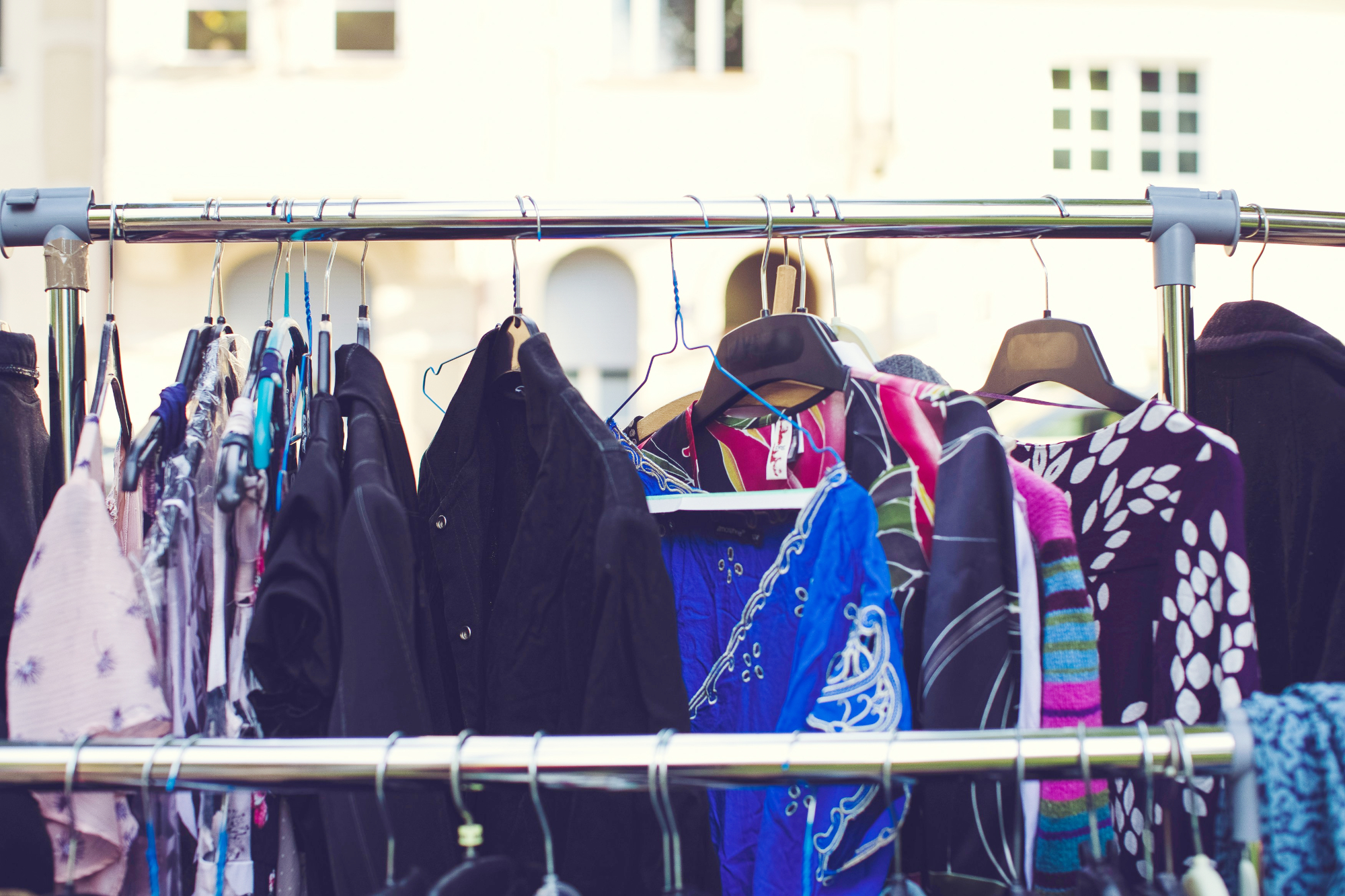 Rail Of Coats Hanging At A Jumble Sale