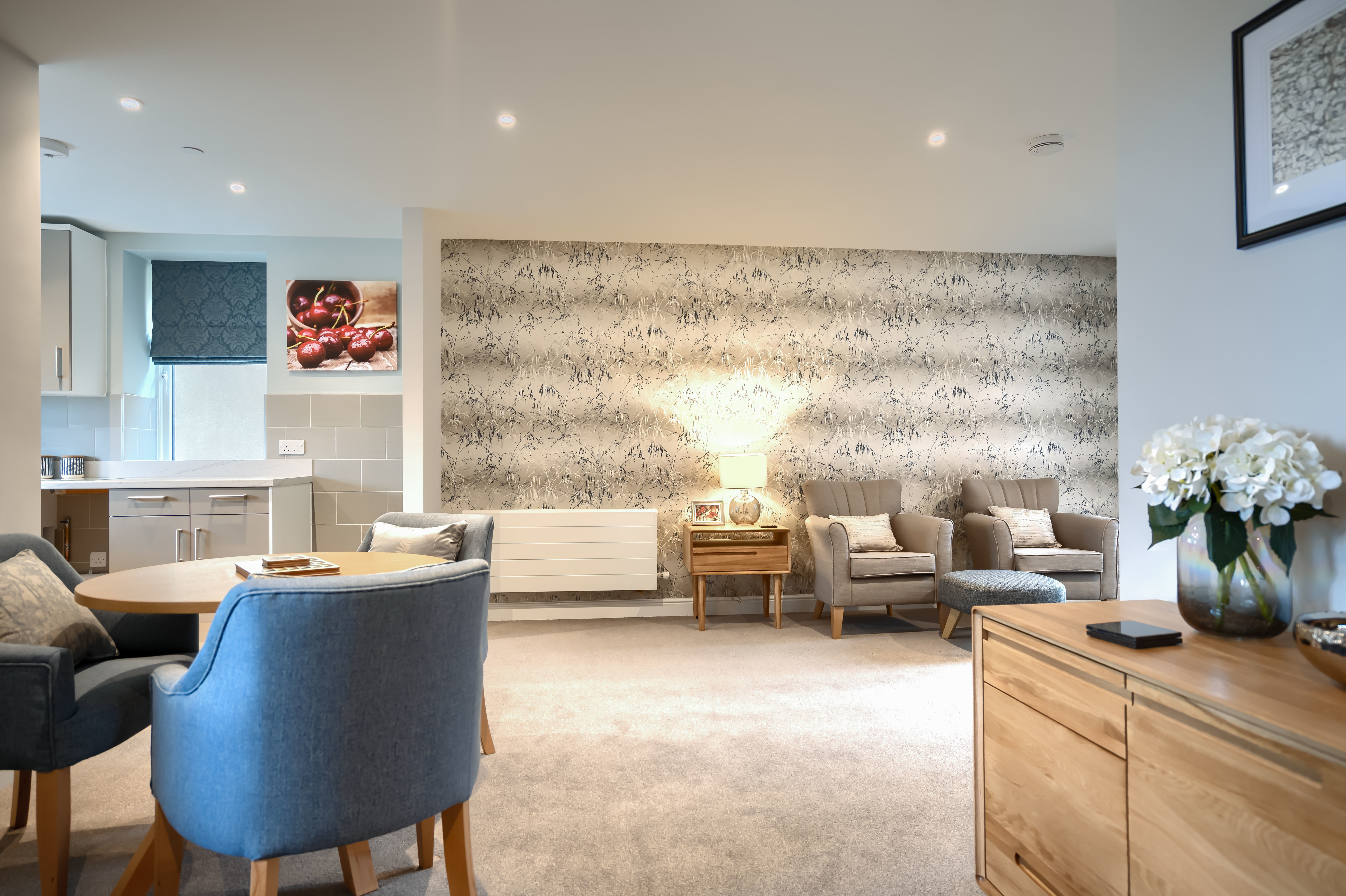 A bright spacious lounge with seating for the residents