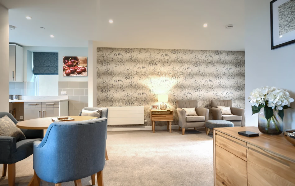 A bright spacious lounge with seating for the residents