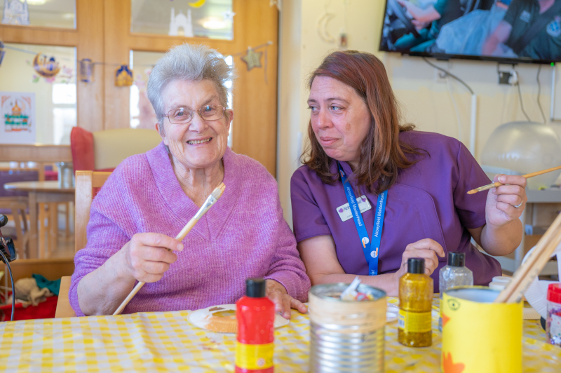 resident-and-staff-enjoy-an-arts-and-crafts-session-together at Nicholas House, Slough SL1 7BN