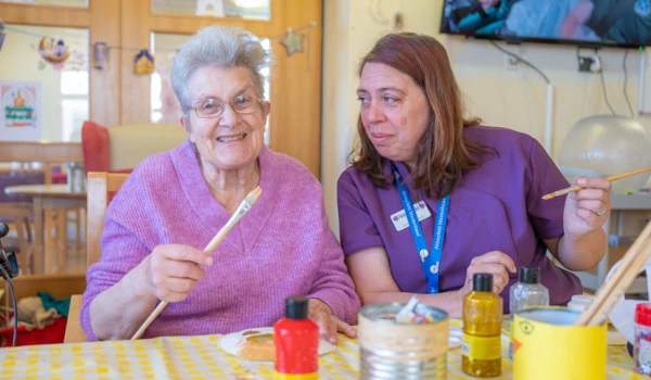 resident-and-staff-enjoy-an-arts-and-crafts-session-together at Nicholas House, Slough SL1 7BN