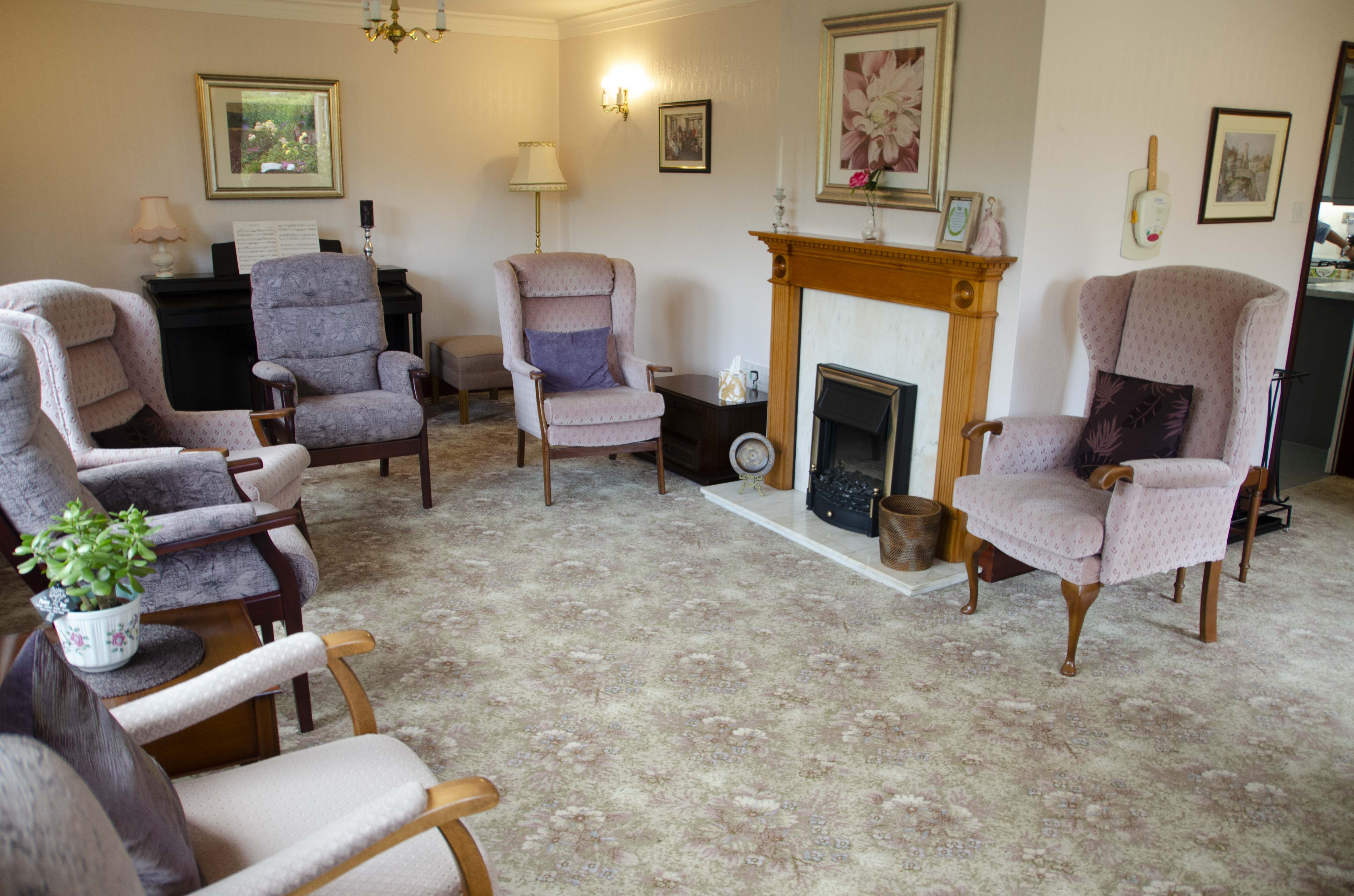 Lounge area with cosy lighting and high-back chairs at Castle View House, BB7 2DT