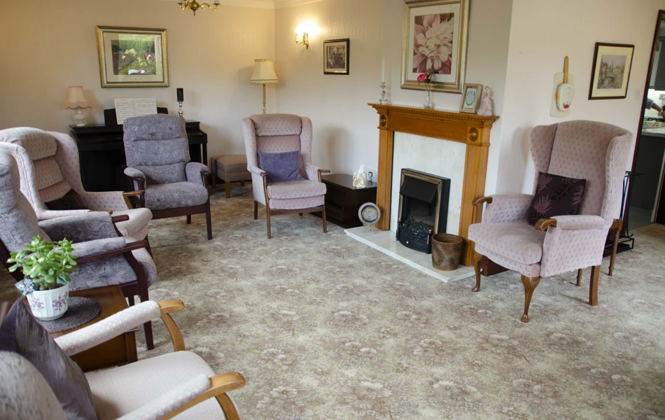 Lounge area with cosy lighting and high-back chairs at Castle View House, BB7 2DT