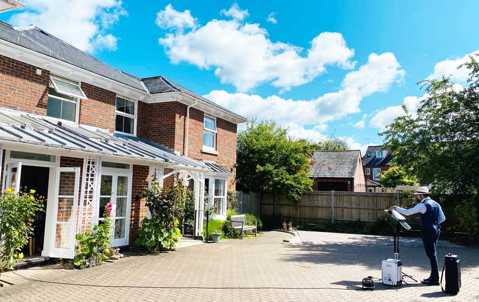 Saxophonist plays outside Abbeyfield House Romsey