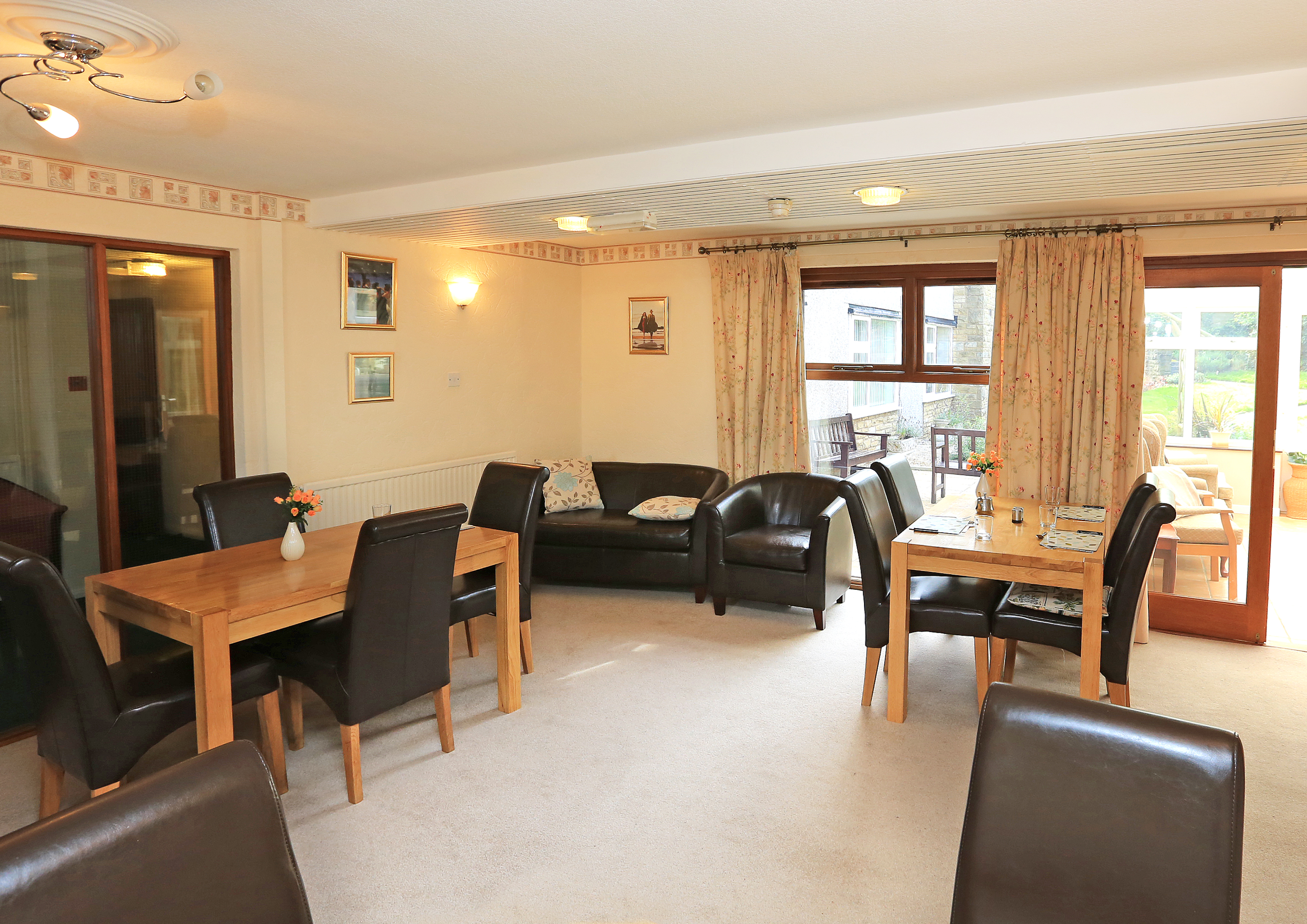 Two tables and a sofa for residents to relax