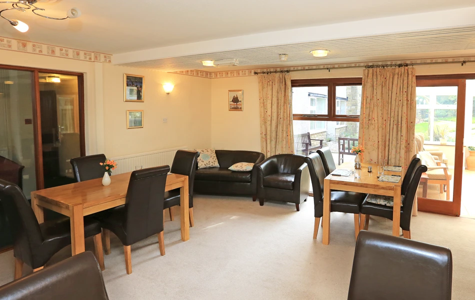 Two tables and a sofa for residents to relax