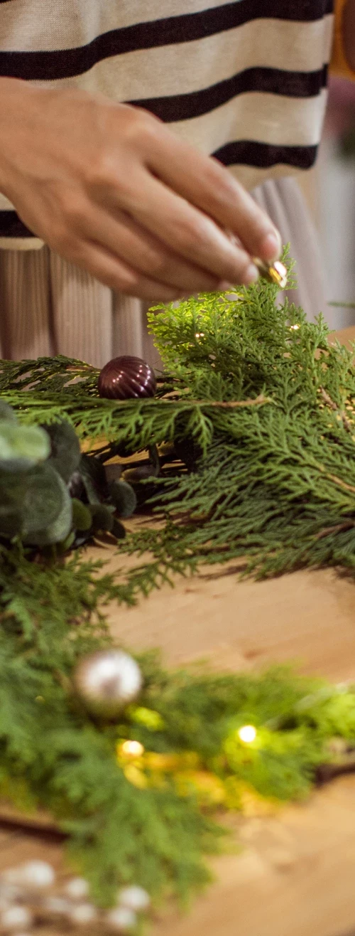 Woman gathering materials to make her wreath