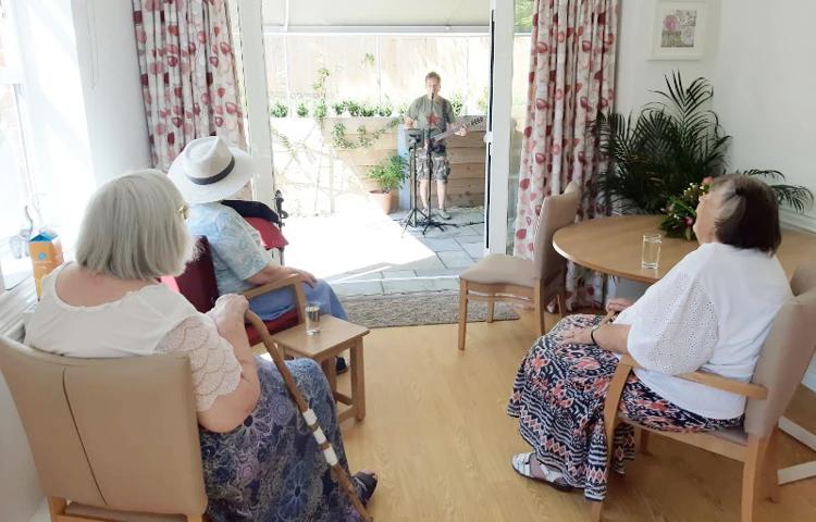 Residents Enjoying A Musical Performance