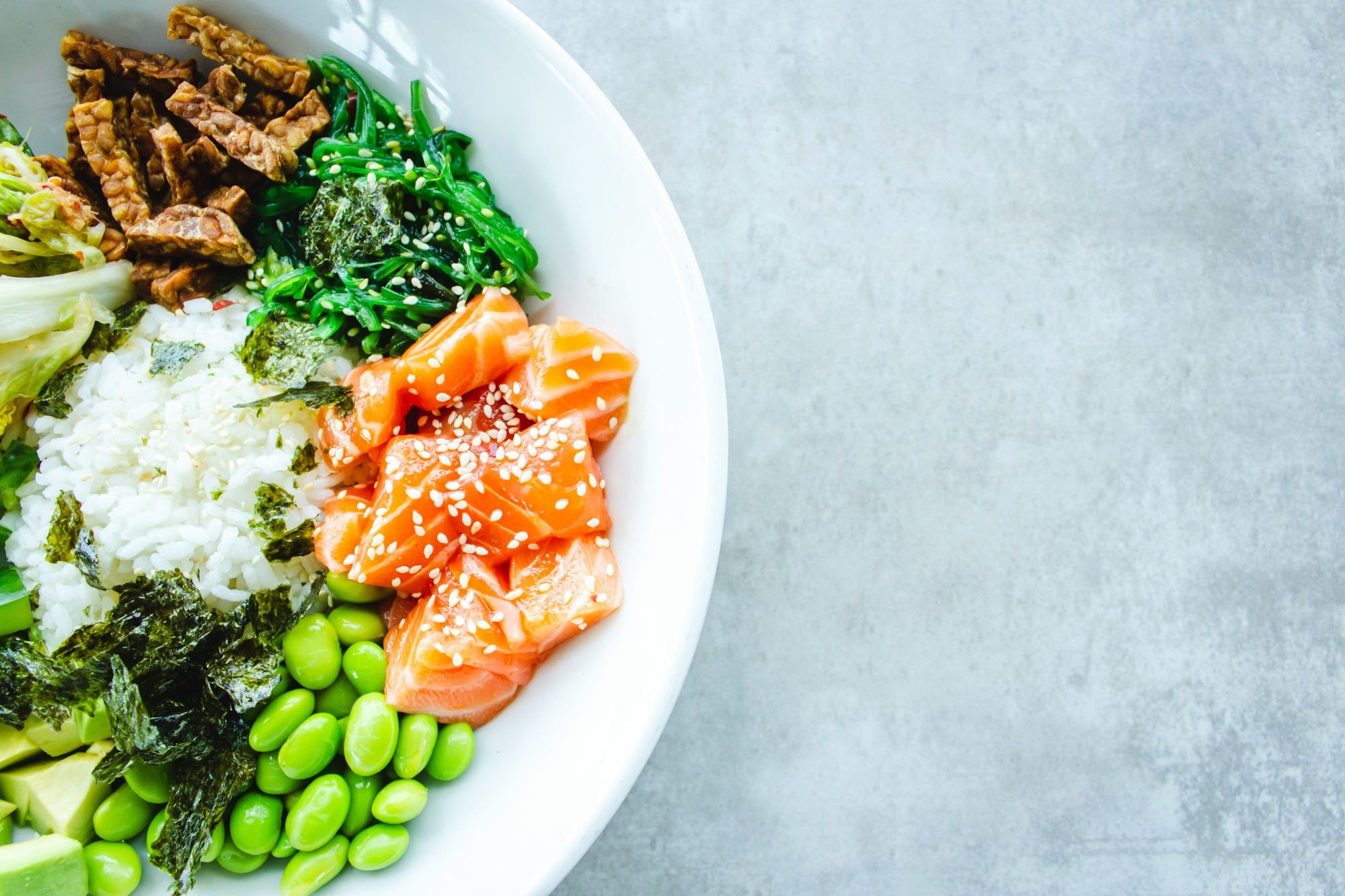 Bowl With A Healthy Dinner Of Salmon, Rice And Vegetables
